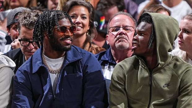 Shedeur Sanders and Travis Hunter enjoying  Denver Nuggets opener at Ball Arena